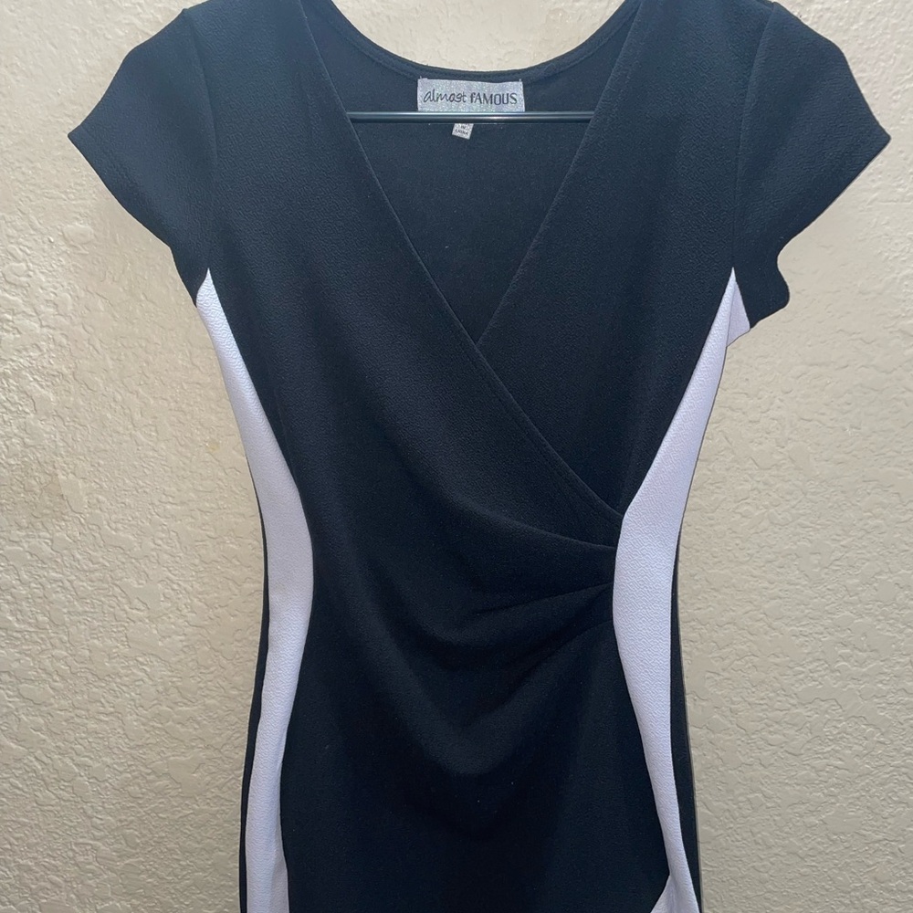 Almost Famous Black and White Asymmetrical Cap Sleeve Blouse